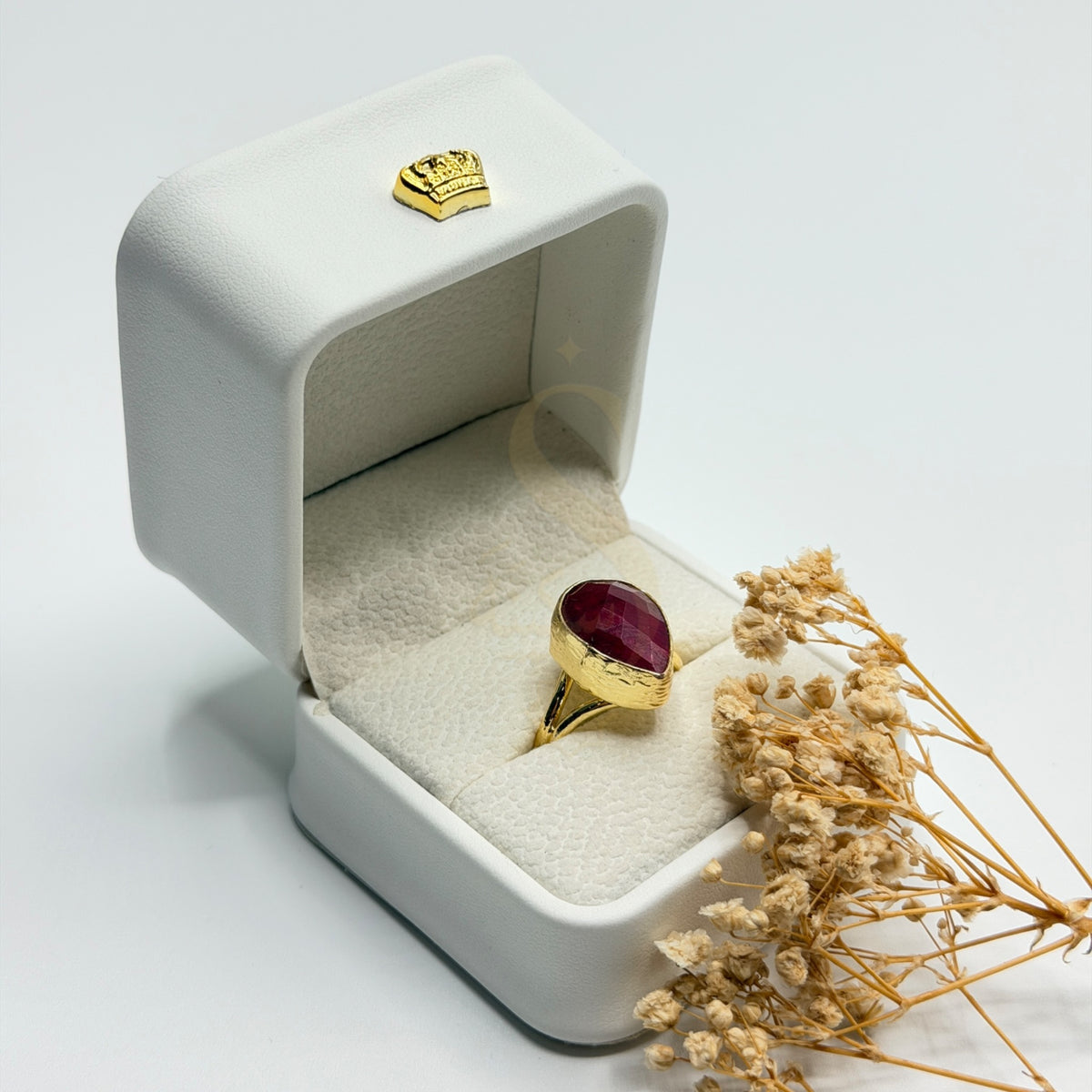 Natural Red Ruby gold plated statement ring in a Sakinah presentation box, angled view
