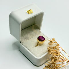 Natural Purplish Red Ruby gold plated statement ring in a Sakinah presentation box, angled view