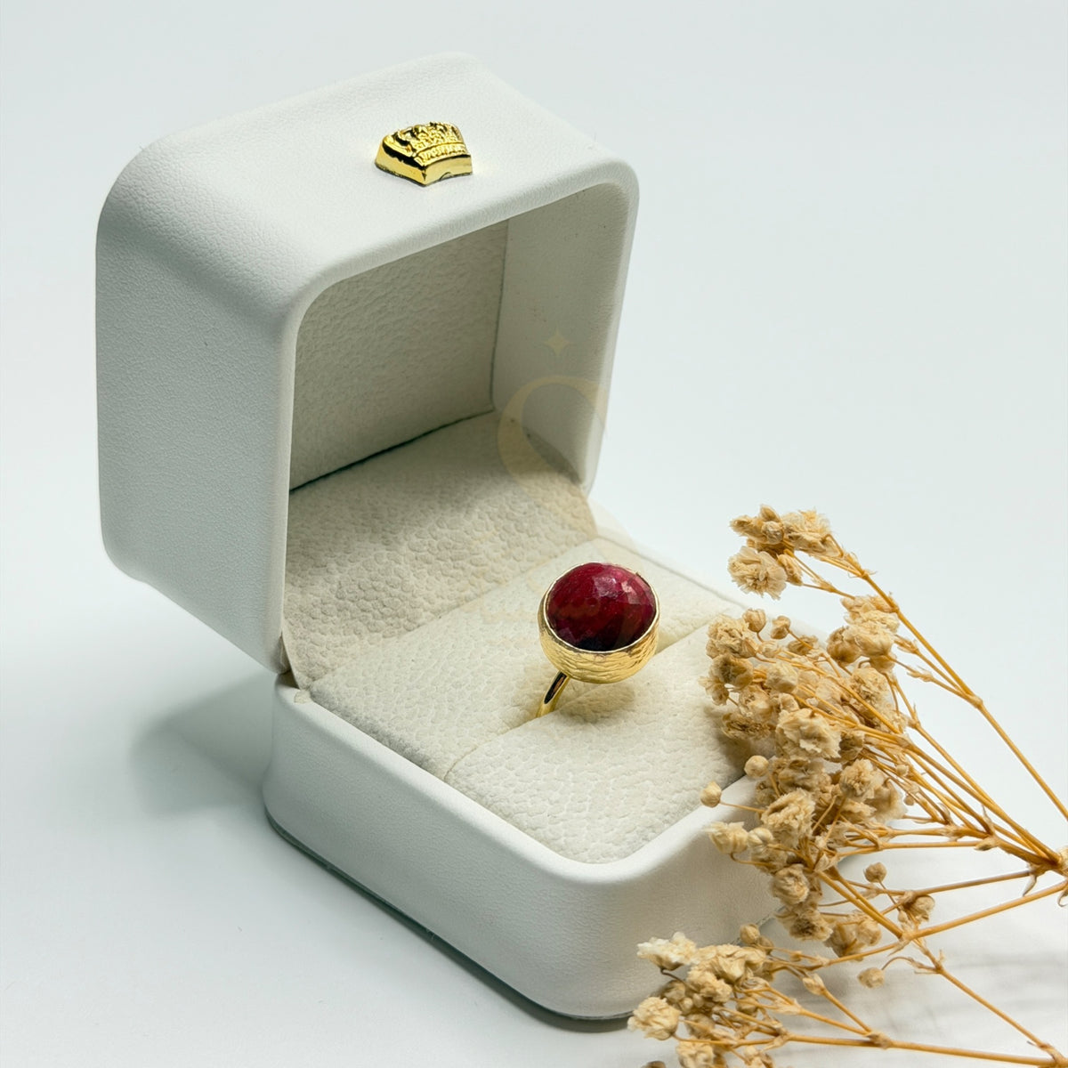 Round Natural Ruby statement ring in a Sakinah presentation box, angled view