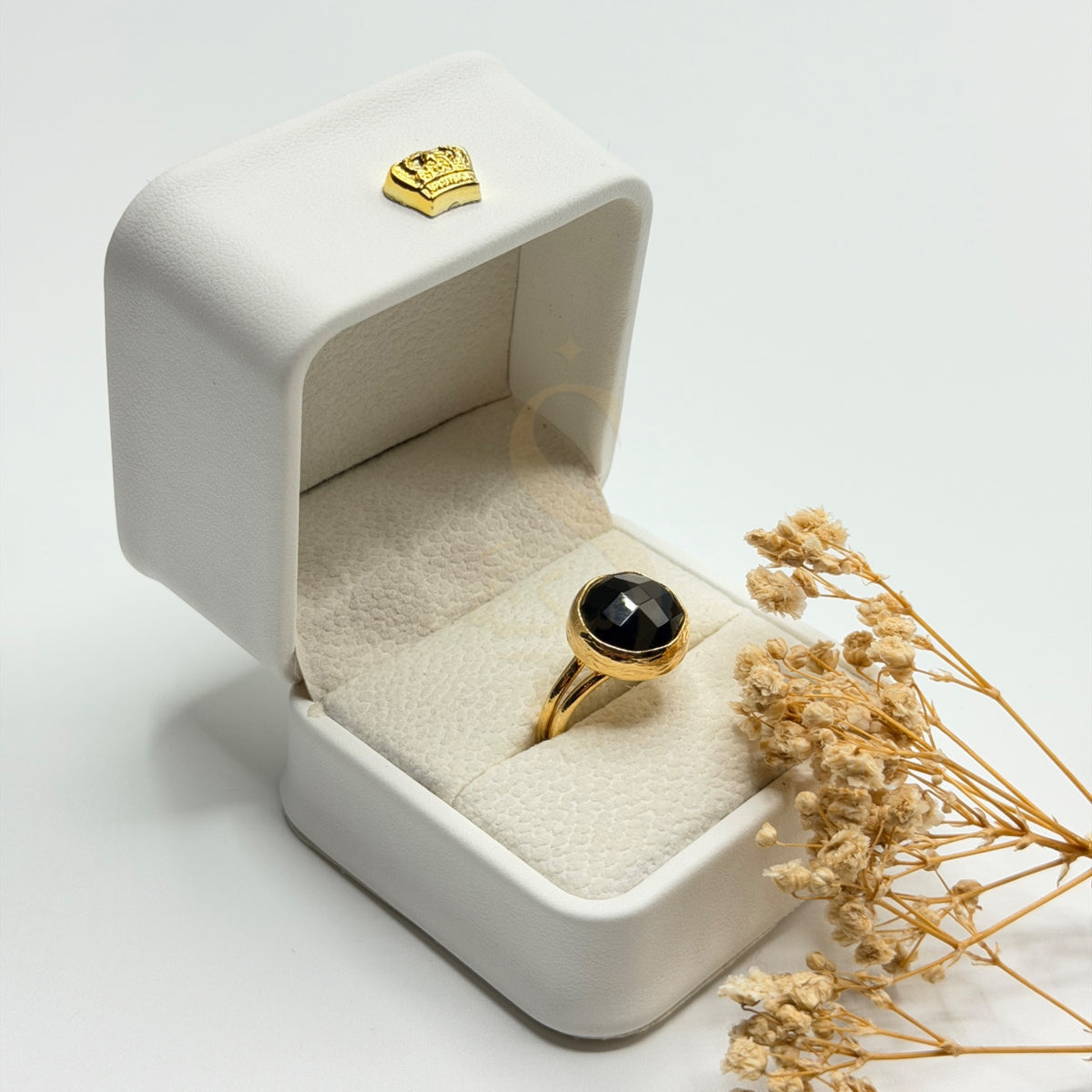 Faceted Black Onyx natural stone ring in a Sakinah presentation box, angled view