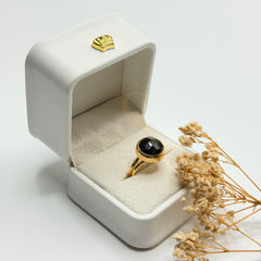 Faceted Black Onyx natural stone ring in a Sakinah presentation box, angled view