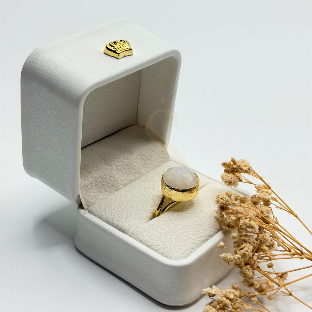 Rainbow Moonstone statement ring in a Sakinah presentation box, angled view
