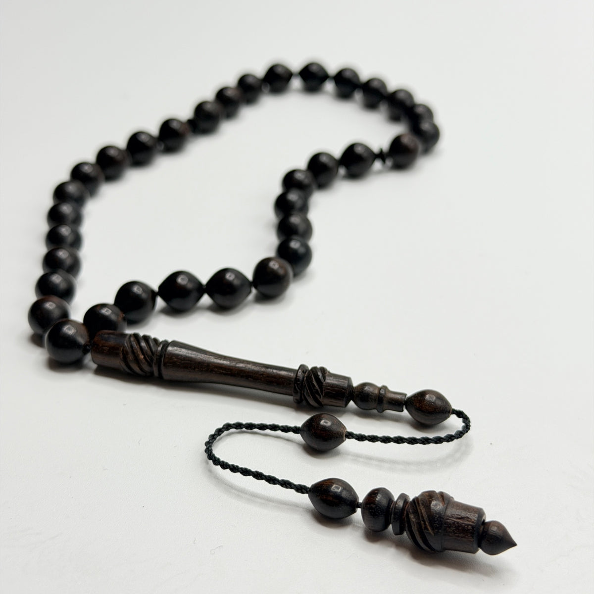Handmade ebony 33 bead Tasbih on a white background