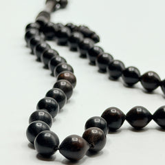Close view of the natural grain in polished ebony Tasbih beads