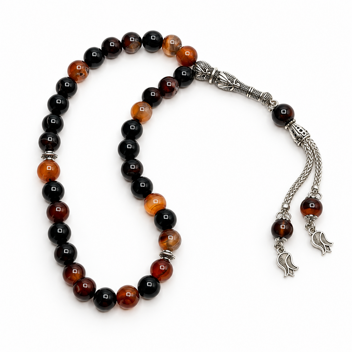 Polished black and warm brown Aqeeq beads with ornate metal tassel