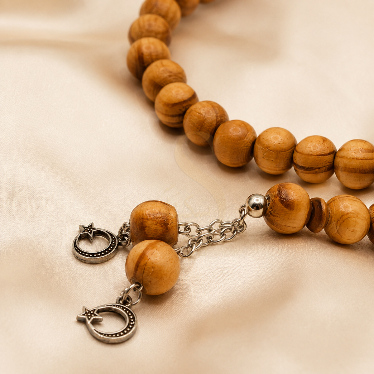 Close view of olivewood Tasbih beads and crescent and star charms