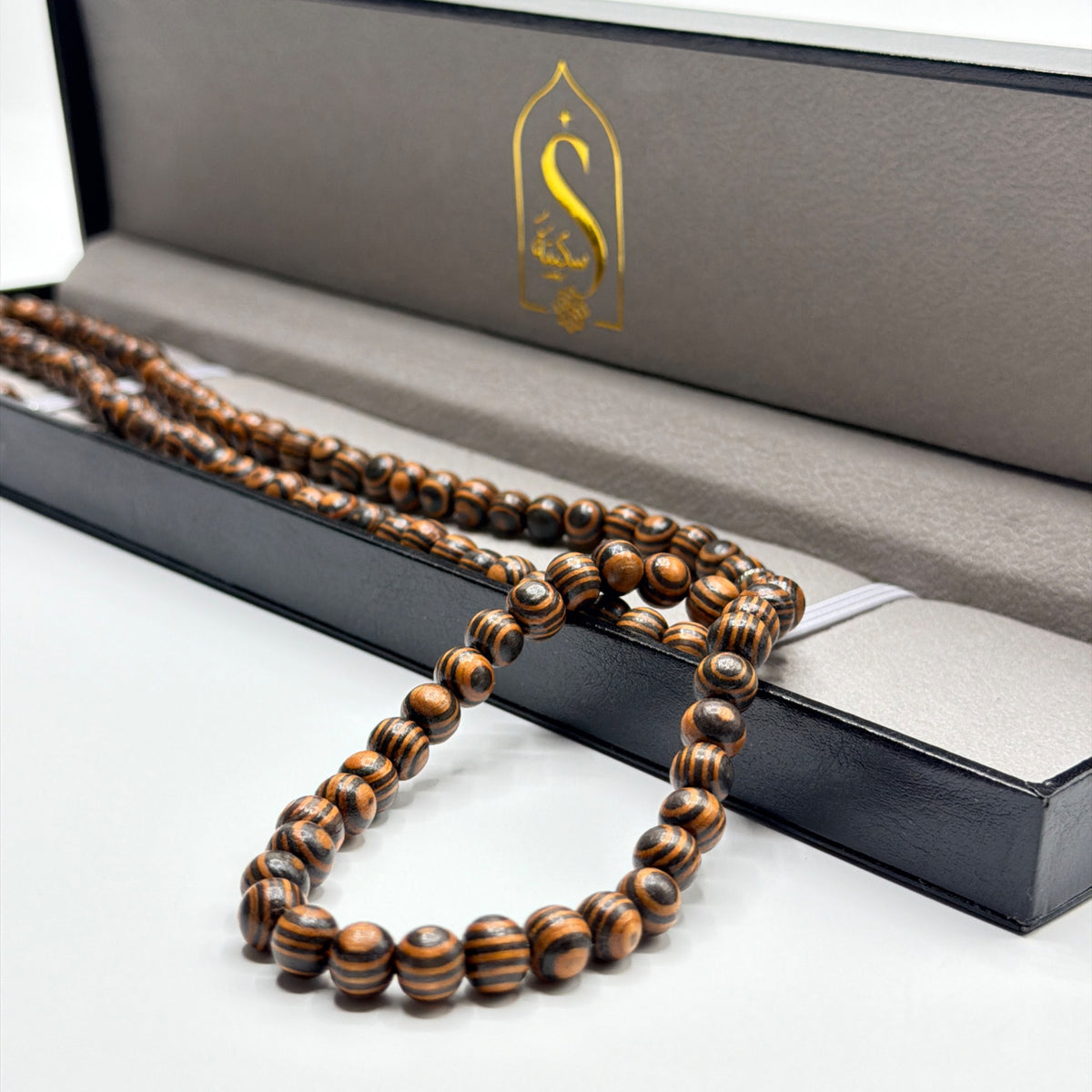 Close presentation of Kafur camphor wood beads with Sakinah luxury gift box