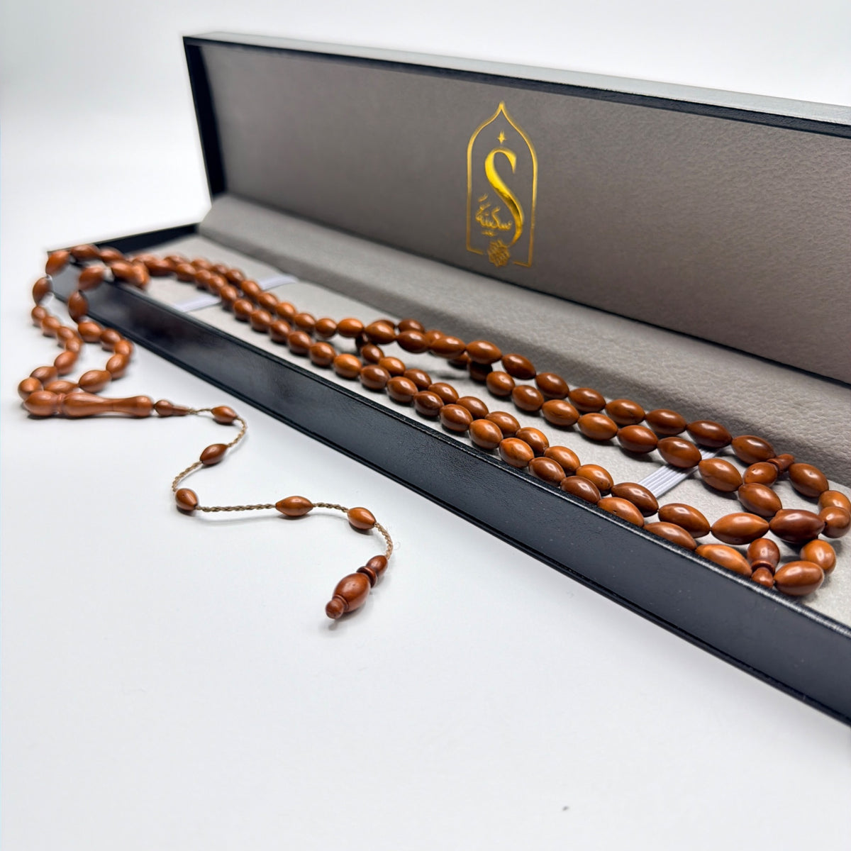 Handmade Kuka wood 99 bead Tasbih presented in a large luxury leather gift box