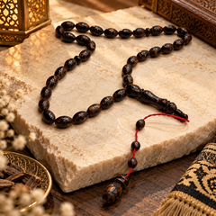 Handmade cinnamon wood 33 bead tasbih on a cream studio background