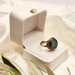 Angled view of the green aqeeq ring and ornate antique finish setting
