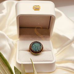 Medium green aqeeq brass ring with Allah calligraphy, presented in a Sakinah ring box