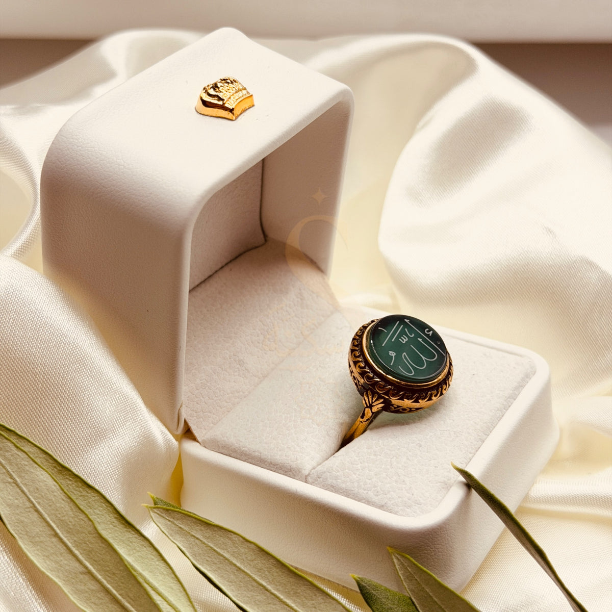Side view of the medium green aqeeq ring and ornate antique gold tone setting