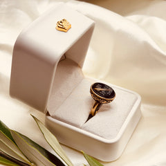 Side view of the small black aqeeq ring and antique gold tone setting