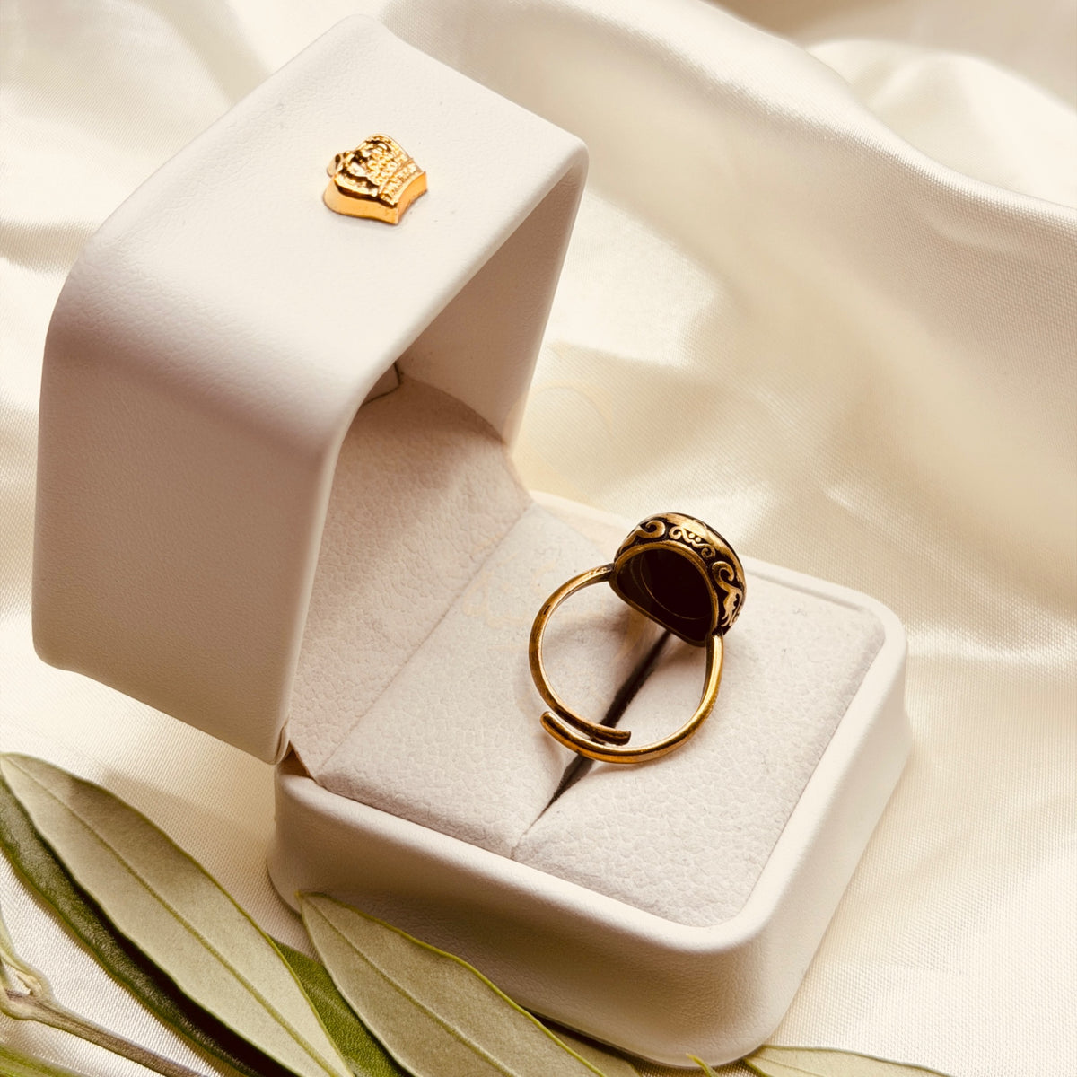 Back view of the black aqeeq ring and its adjustable handmade brass band
