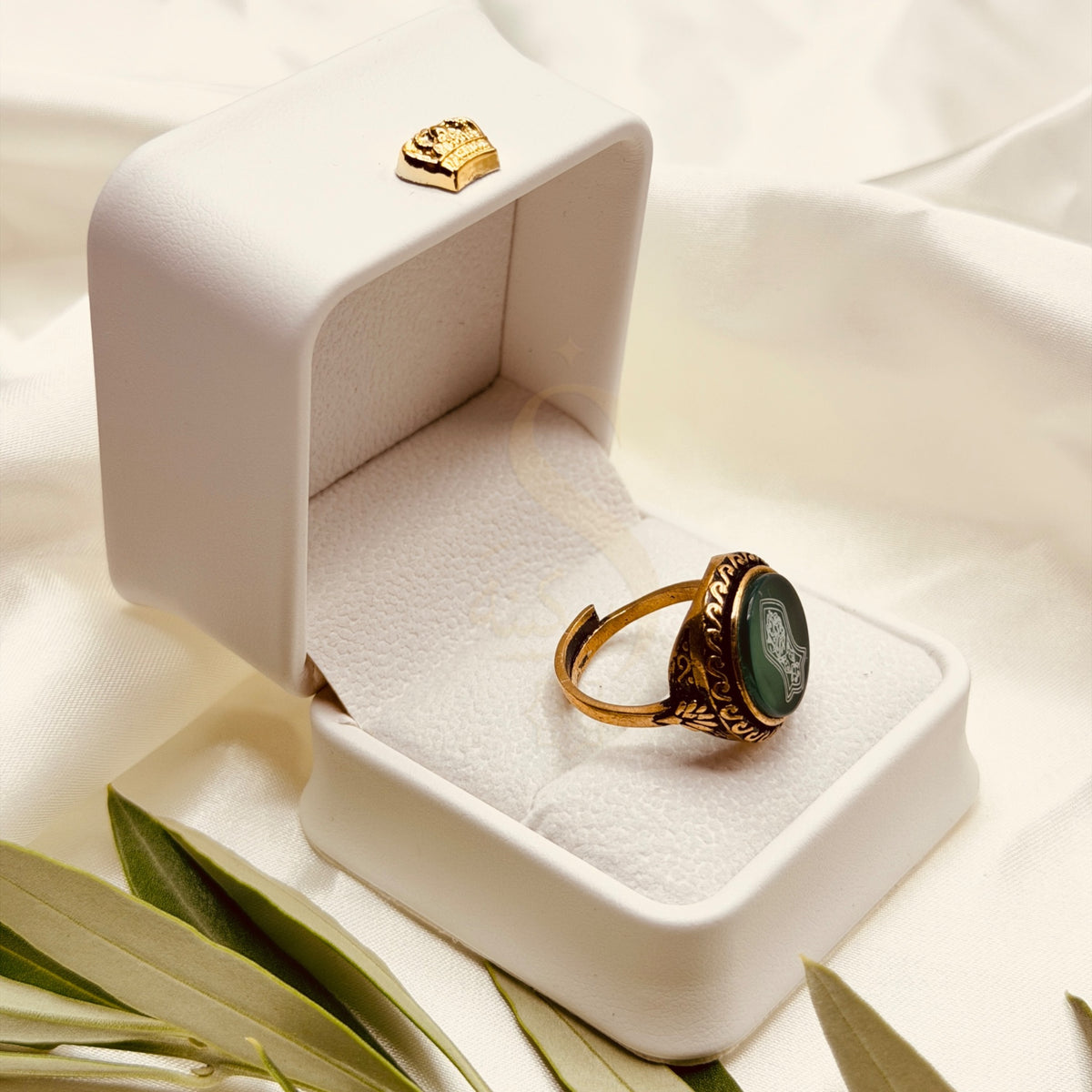 Side view of the green aqeeq ring with an adjustable handmade brass band
