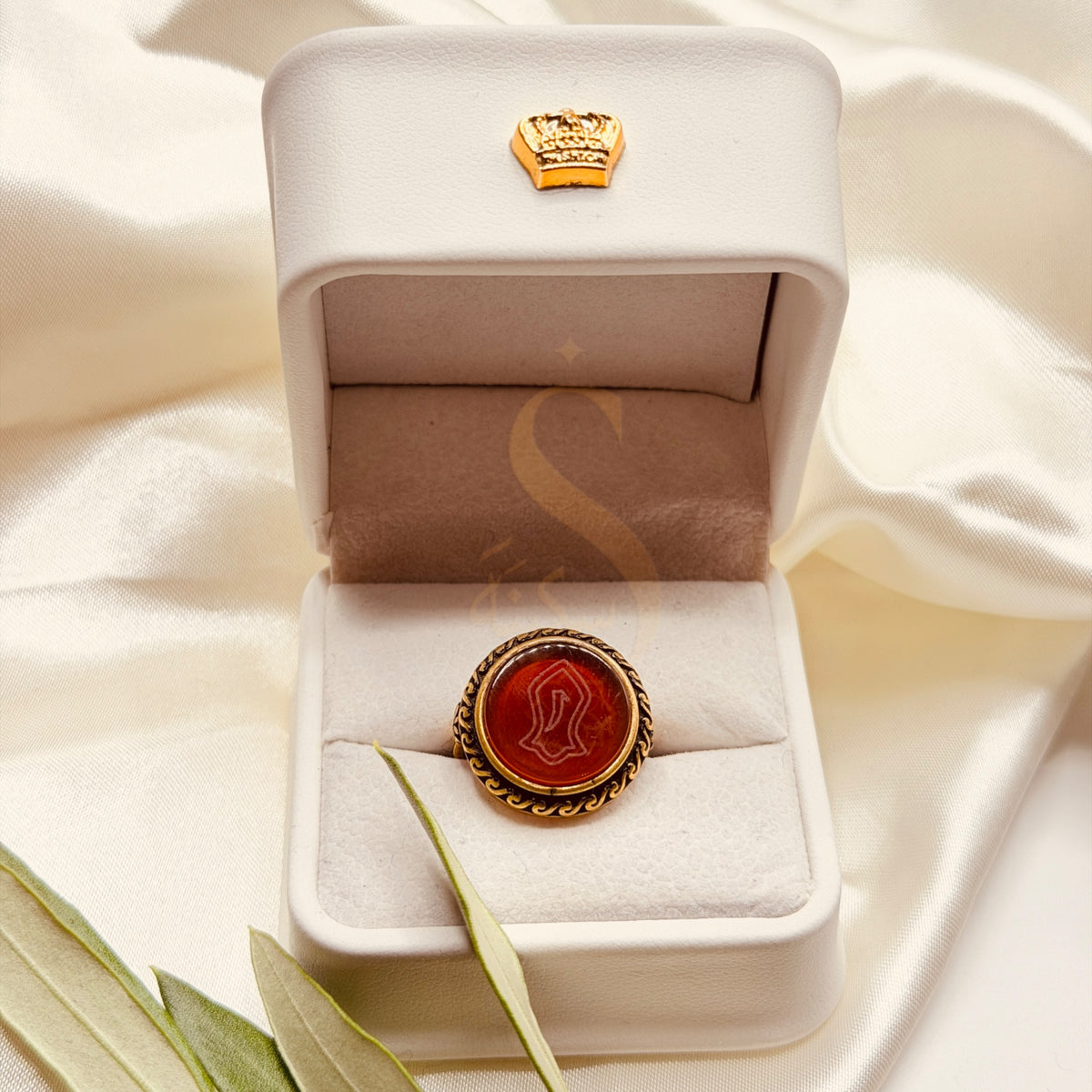 Nalain Mubarak red aqeeq ring presented in a white Sakinah ring box