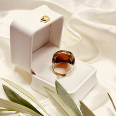 Back view of the red aqeeq ring with an adjustable handmade brass band