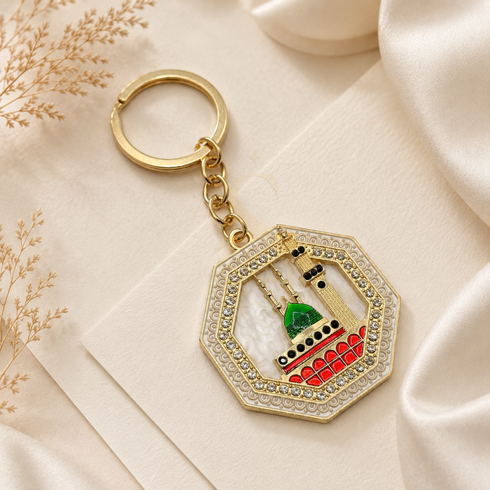 Gold-tone Rawda keychain depicting the Green Dome and minaret with crystal-style accents