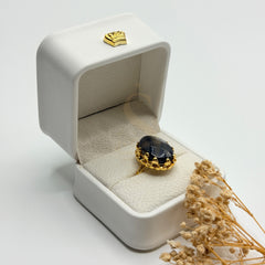 Side view of the faceted black and grey Sulemani Aqeeq and ornate gold plated setting
