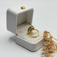 Rear view of the black and white Sulemani Aqeeq ring showing its adjustable gold plated band