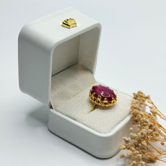 Side view of the vivid Pink Agate stone and ornate gold plated setting