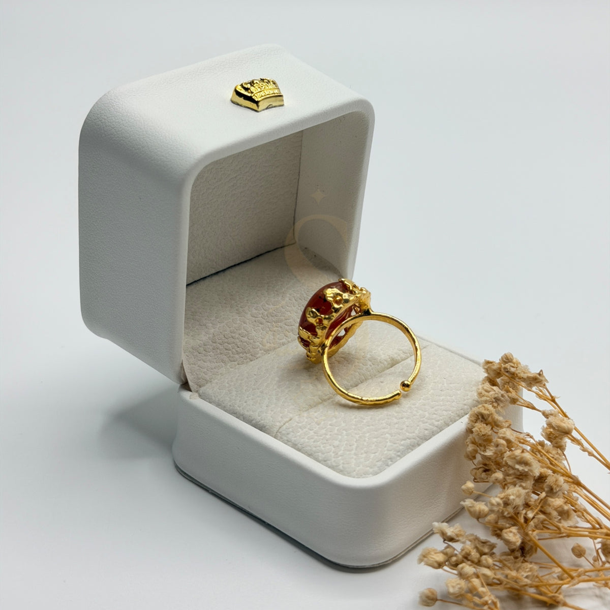Rear view of the Orange Agate ring showing its adjustable gold plated band
