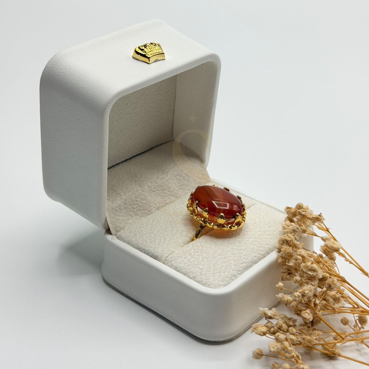 Side view of the translucent Orange Agate stone and ornate gold plated handmade setting