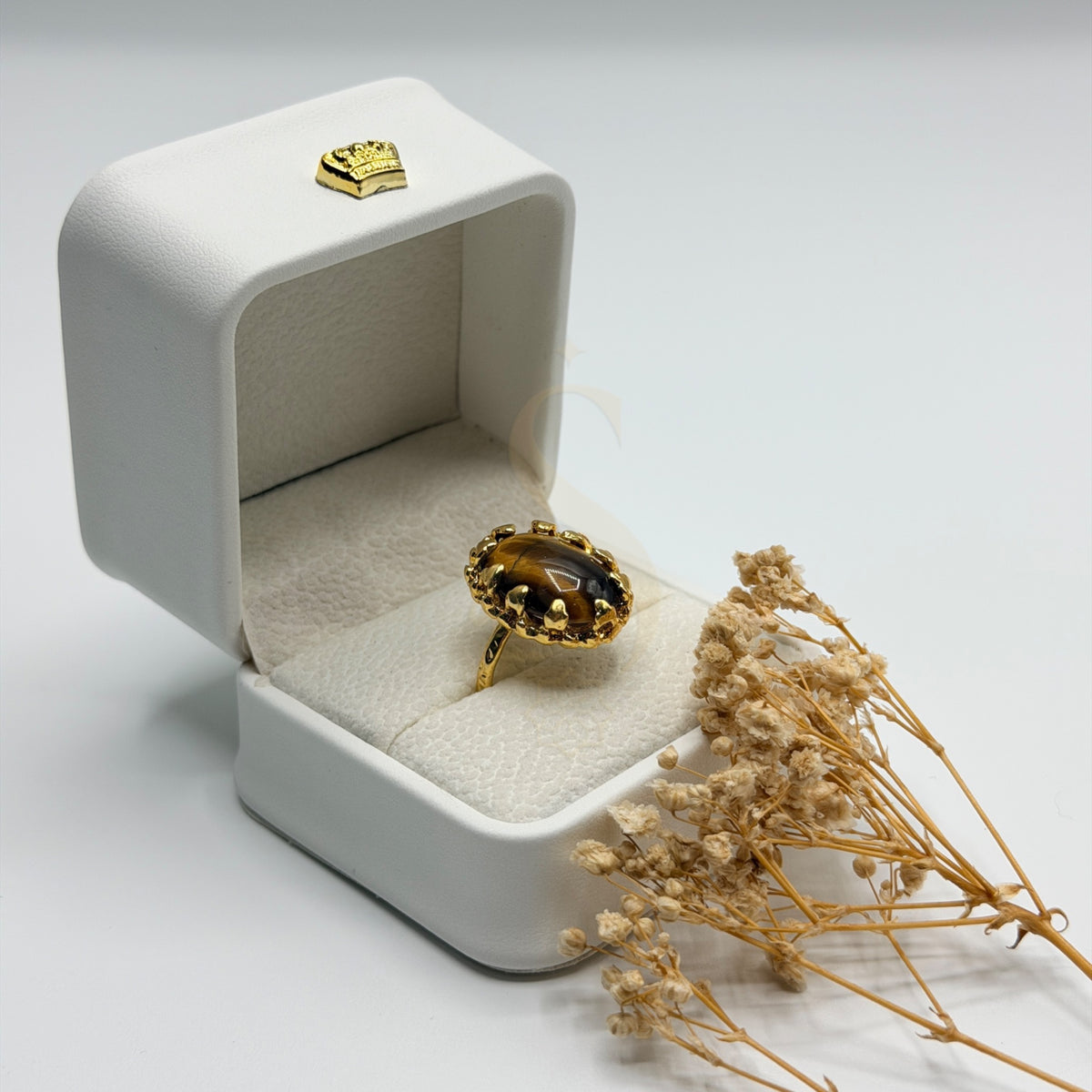 Side view of the Tiger Eye stone and ornate gold plated handmade setting