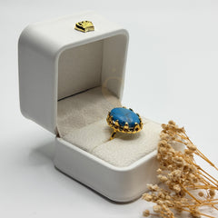 Side view of the blue Turquoise Feroza stone and ornate gold plated handmade setting