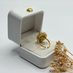Rear view of the white Sulemani Aqeeq ring showing its adjustable gold plated band